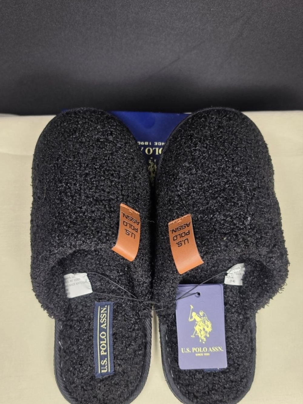 U.S. Polo Assn. Men's Black Fuzzy Slip-On Slippers with Tan Logo Tabs